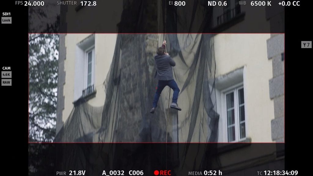 Man climbing a tree with our brown Flex B model